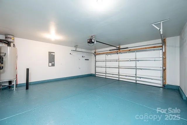an empty room with closet and a chandelier fan
