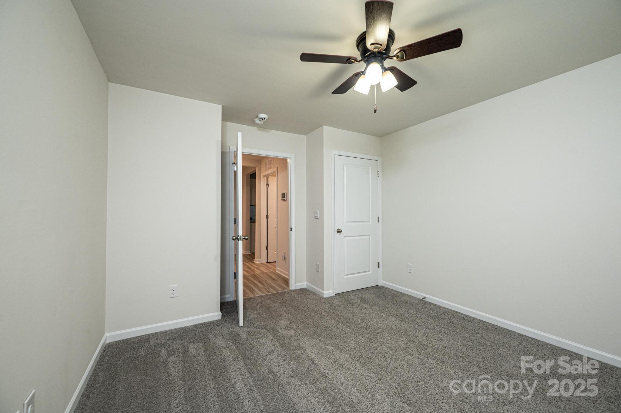2542 Goose Fair Road Maiden, NC 28650 - Photo 33 of 48 an empty room with closet and a chandelier fan