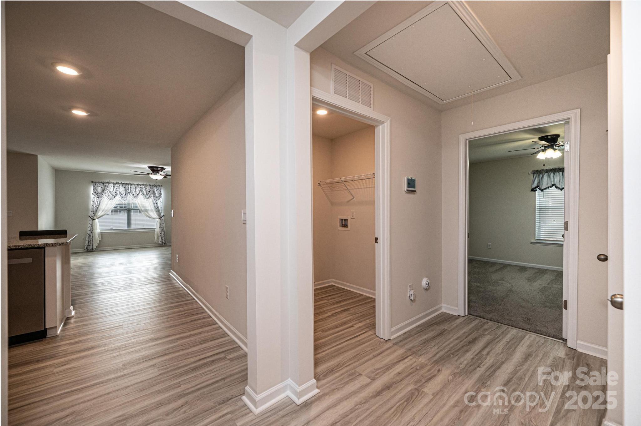 2542 Goose Fair Road Maiden, NC 28650 - Photo 38 of 48 a view of a hallway with wooden floor and a bathroom