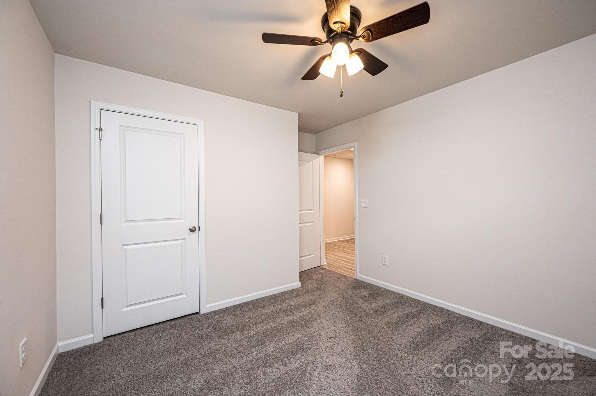 2542 Goose Fair Road Maiden, NC 28650 - Photo 40 of 48 an empty room with chandelier fan