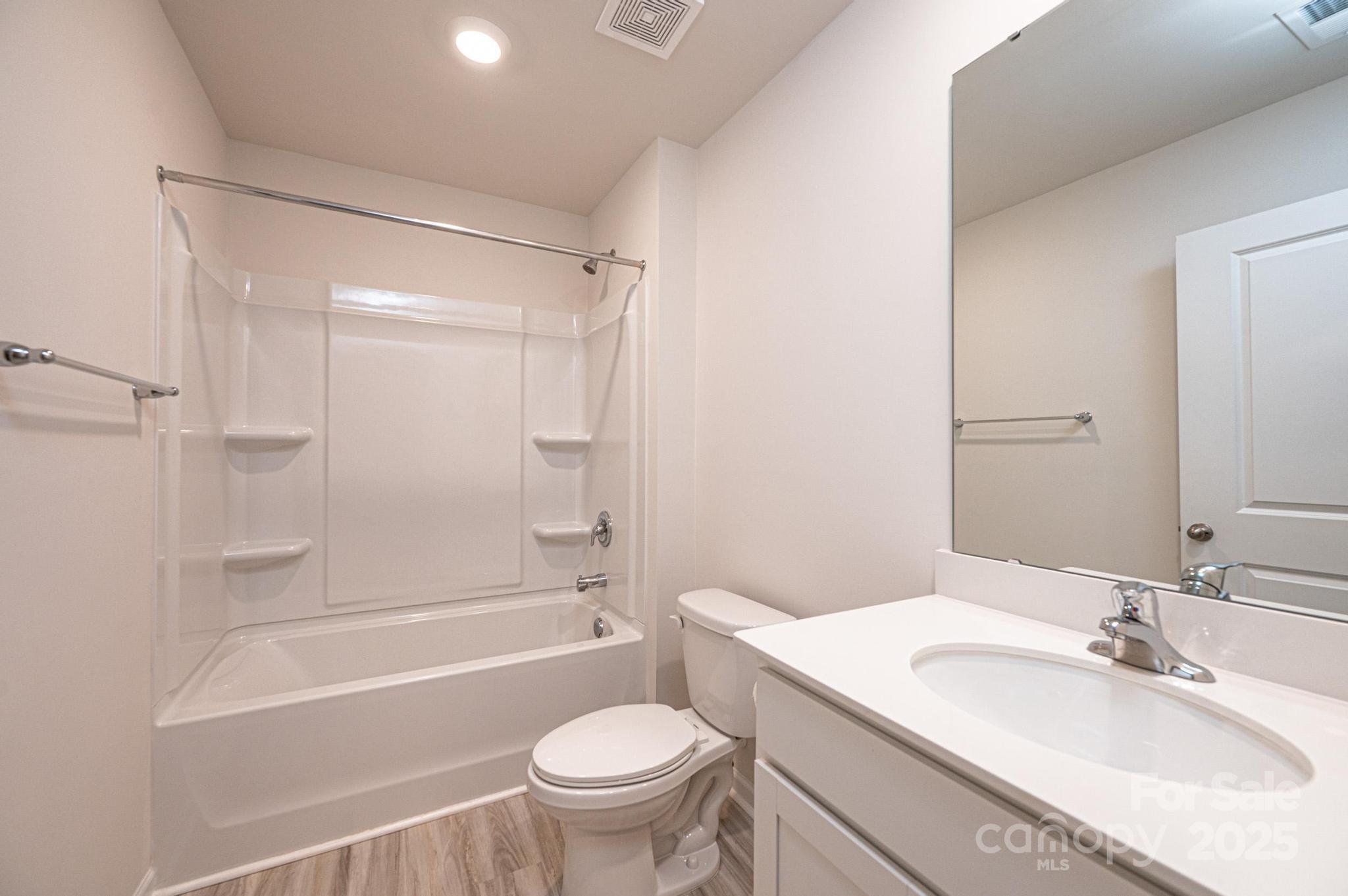 2542 Goose Fair Road Maiden, NC 28650 - Photo 42 of 48 a bathroom with a sink toilet vanity and shower