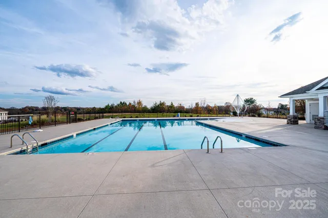 a view of a wrought iron fences in front of house