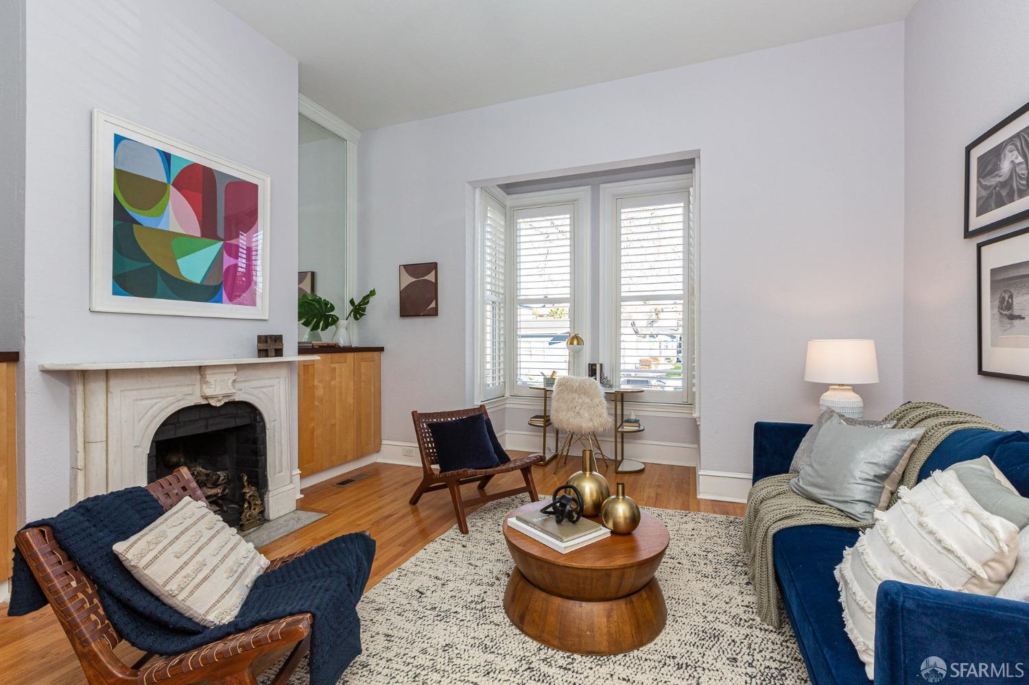 1429 Chestnut Street Oakland, CA 94607 - Photo 4 of 20 a living room with furniture and a fireplace