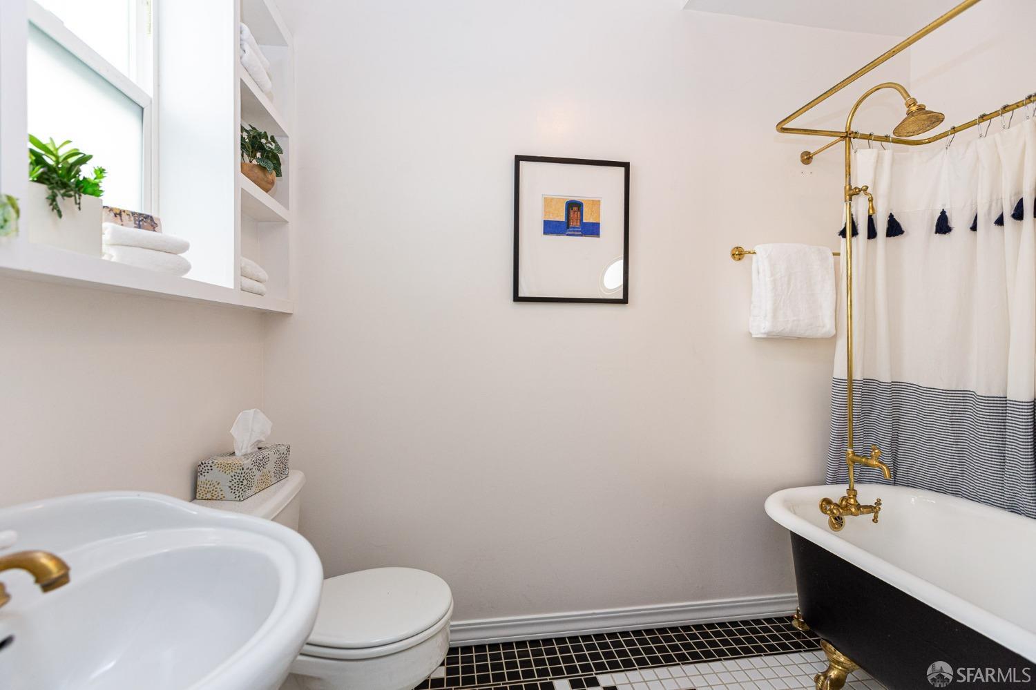 1429 Chestnut Street Oakland, CA 94607 - Photo 7 of 20 a bathroom with a sink toilet and shower