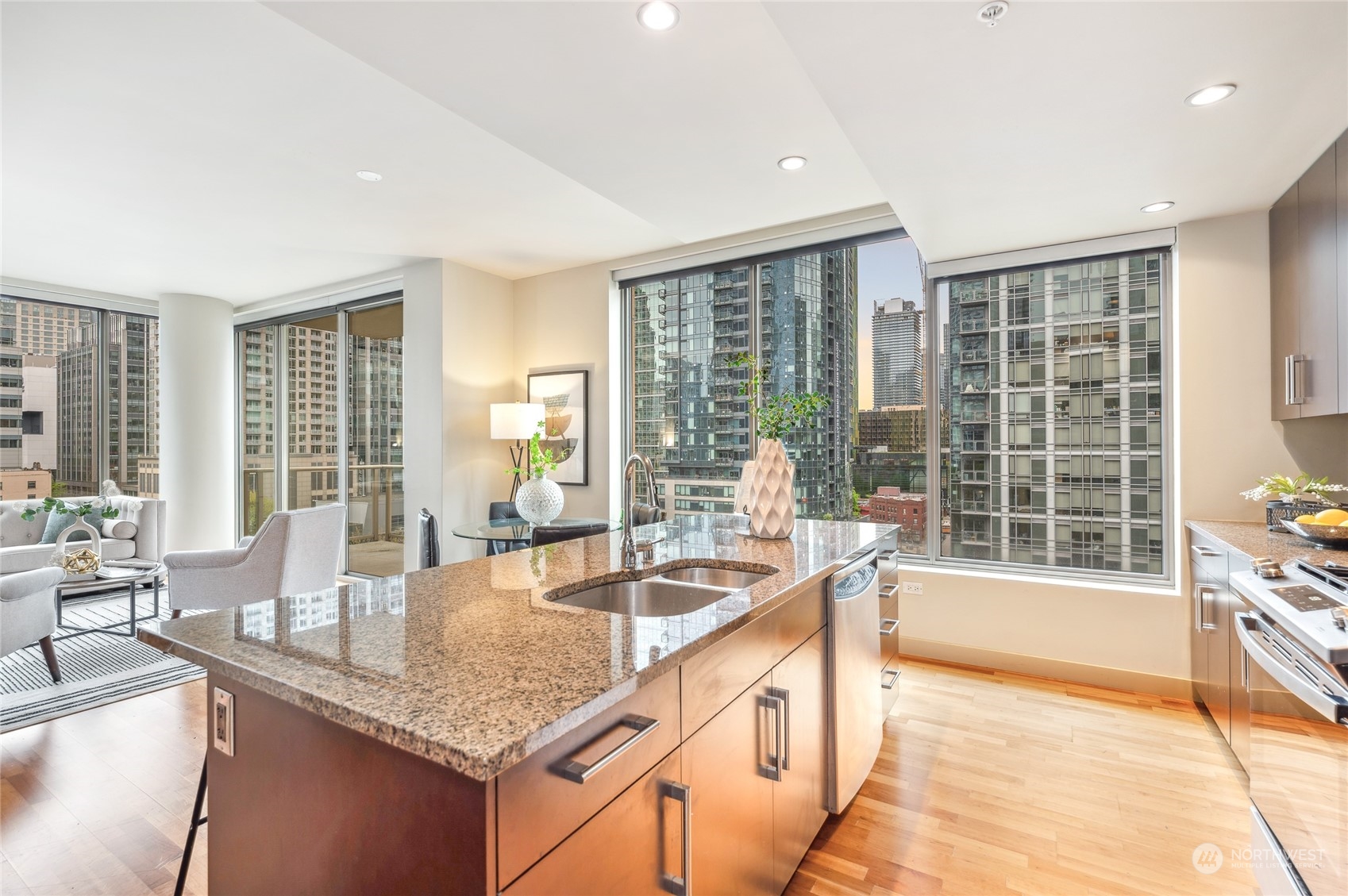 910 Lenora Street, Unit S907 Seattle, WA 98121 - Photo 12 of 38 a kitchen with granite countertop a sink and a counter top space