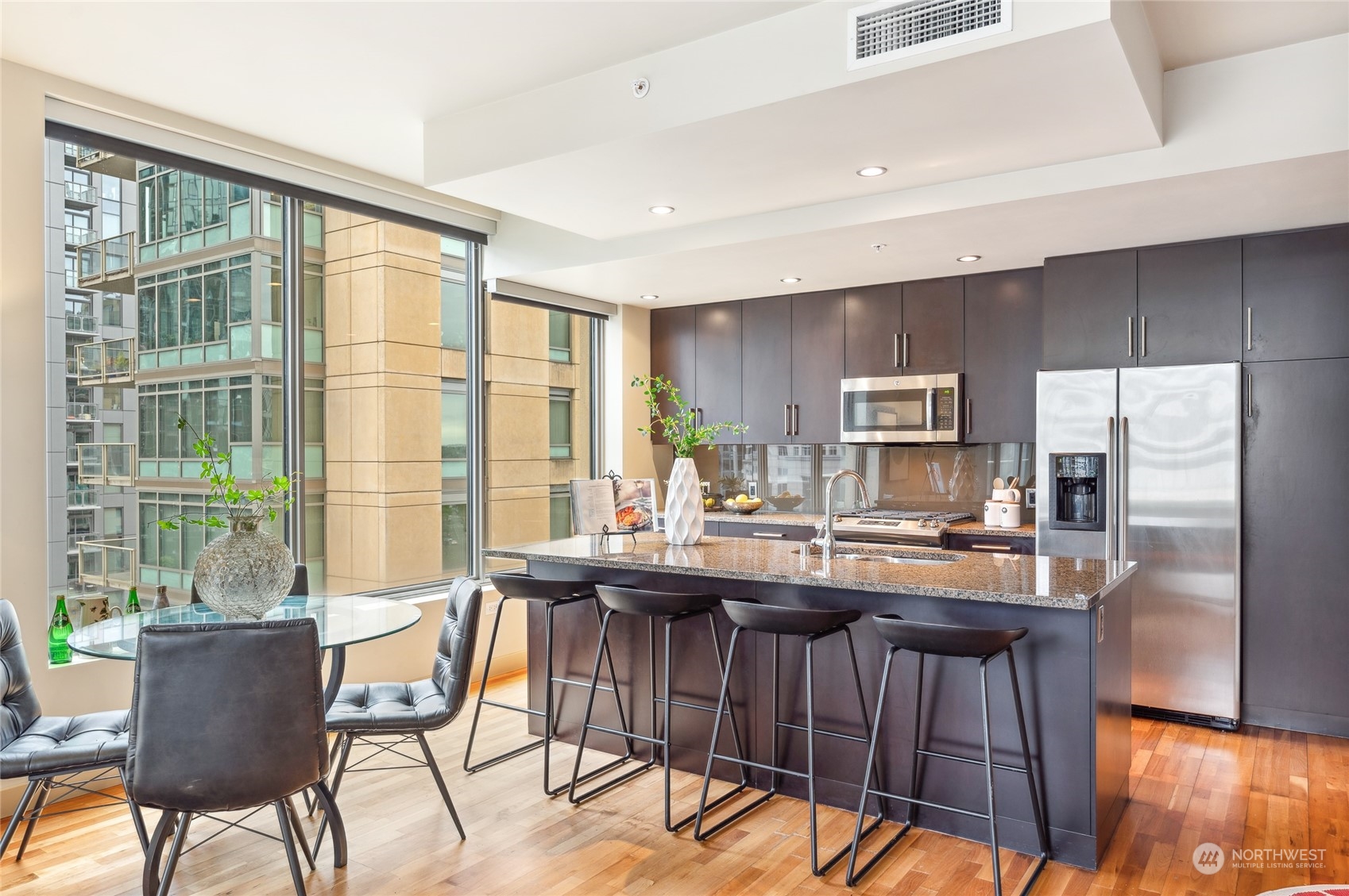 910 Lenora Street, Unit S907 Seattle, WA 98121 - Photo 18 of 38 a view of a dining room with furniture window and outside view