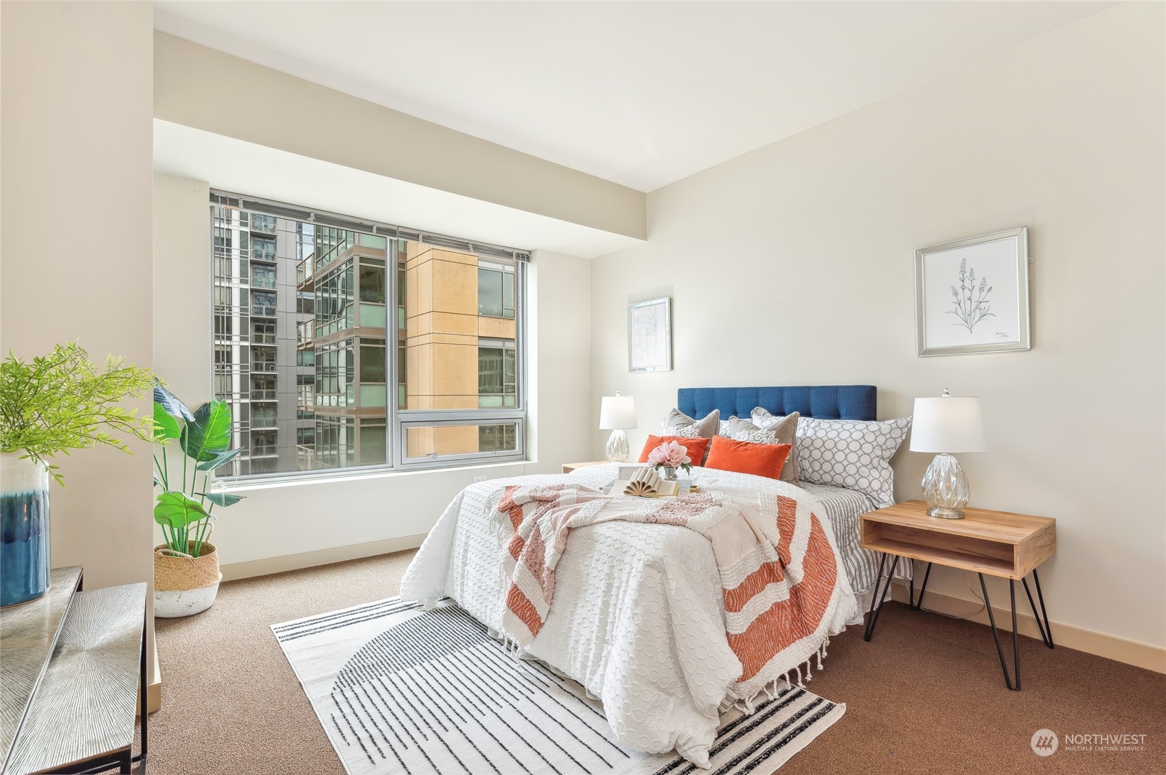 910 Lenora Street, Unit S907 Seattle, WA 98121 - Photo 23 of 38 a bedroom with a bed chair and a window