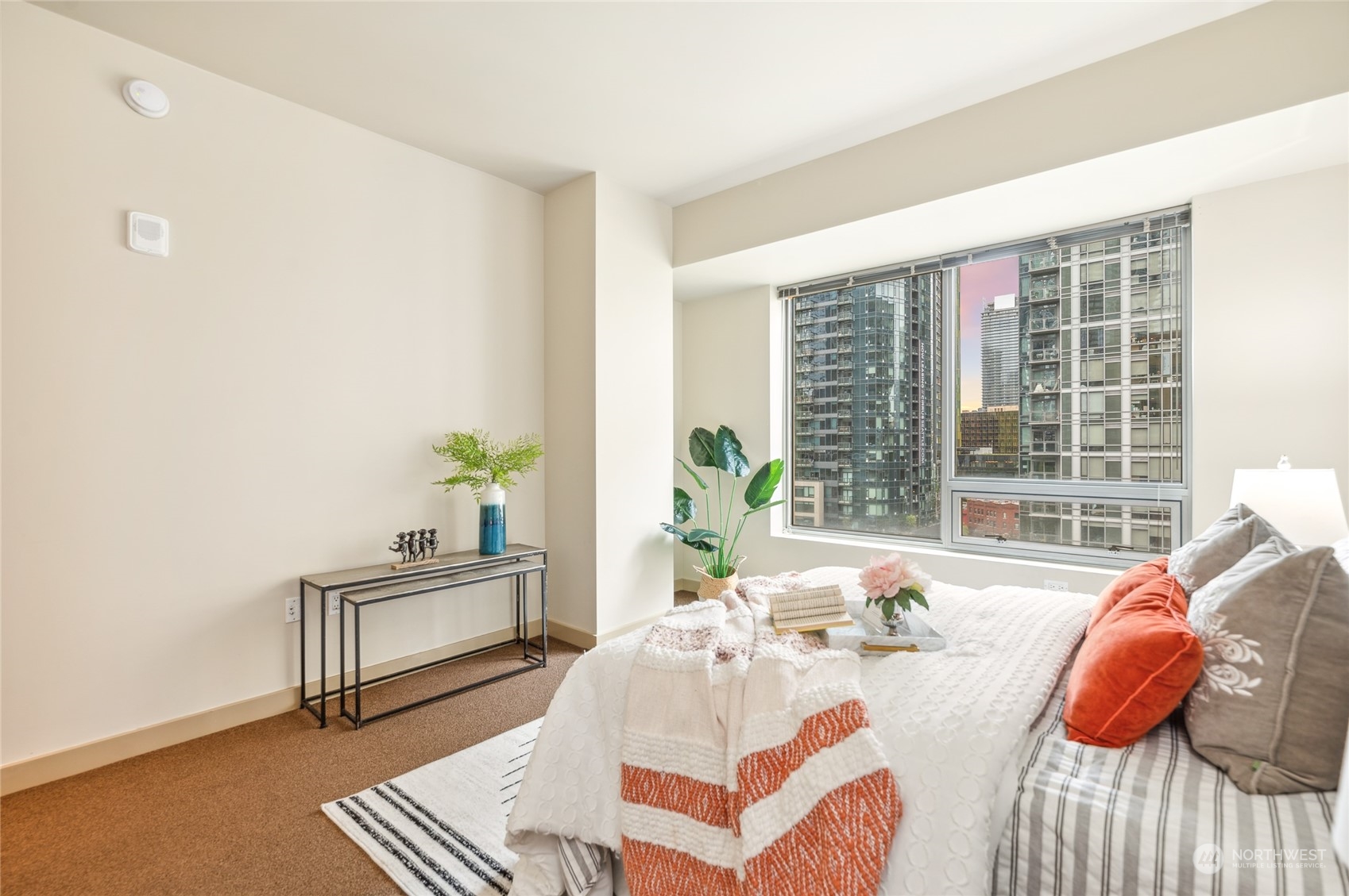 910 Lenora Street, Unit S907 Seattle, WA 98121 - Photo 24 of 38 a bedroom with a bed and a window