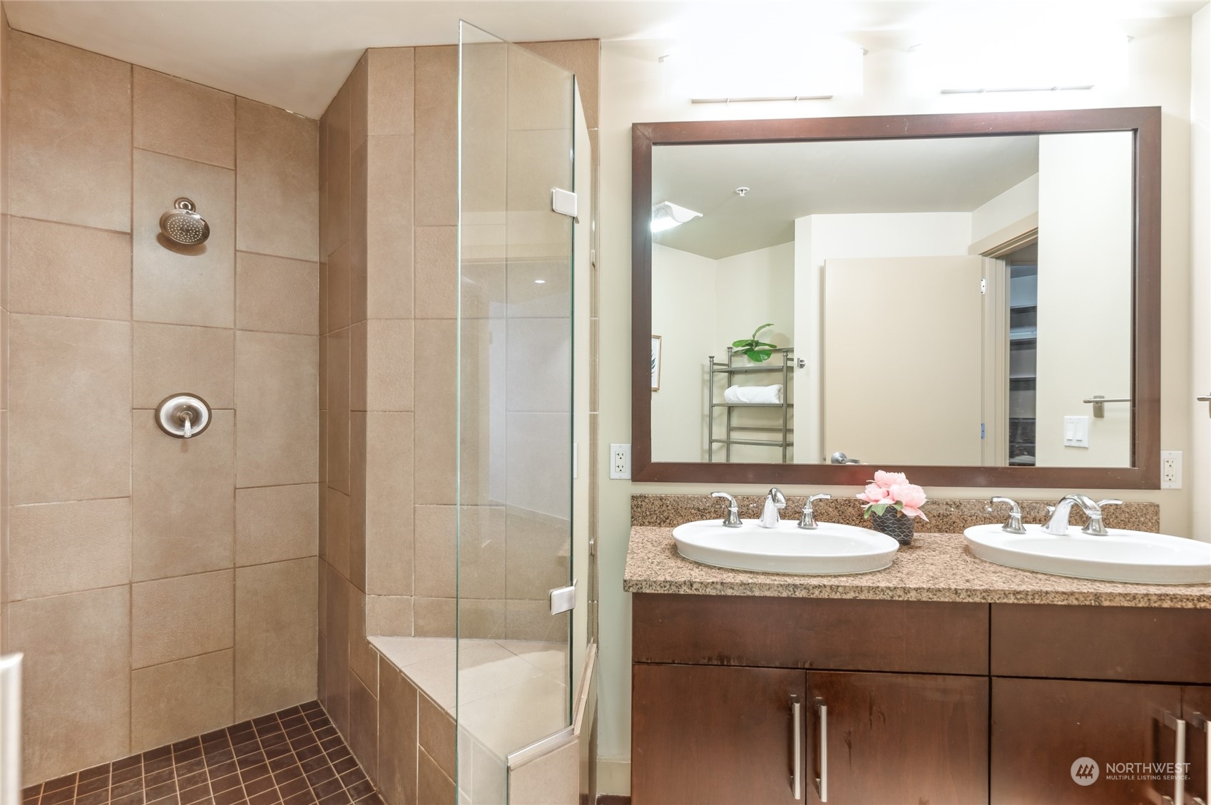 910 Lenora Street, Unit S907 Seattle, WA 98121 - Photo 26 of 38 a bathroom with a sink a toilet and shower