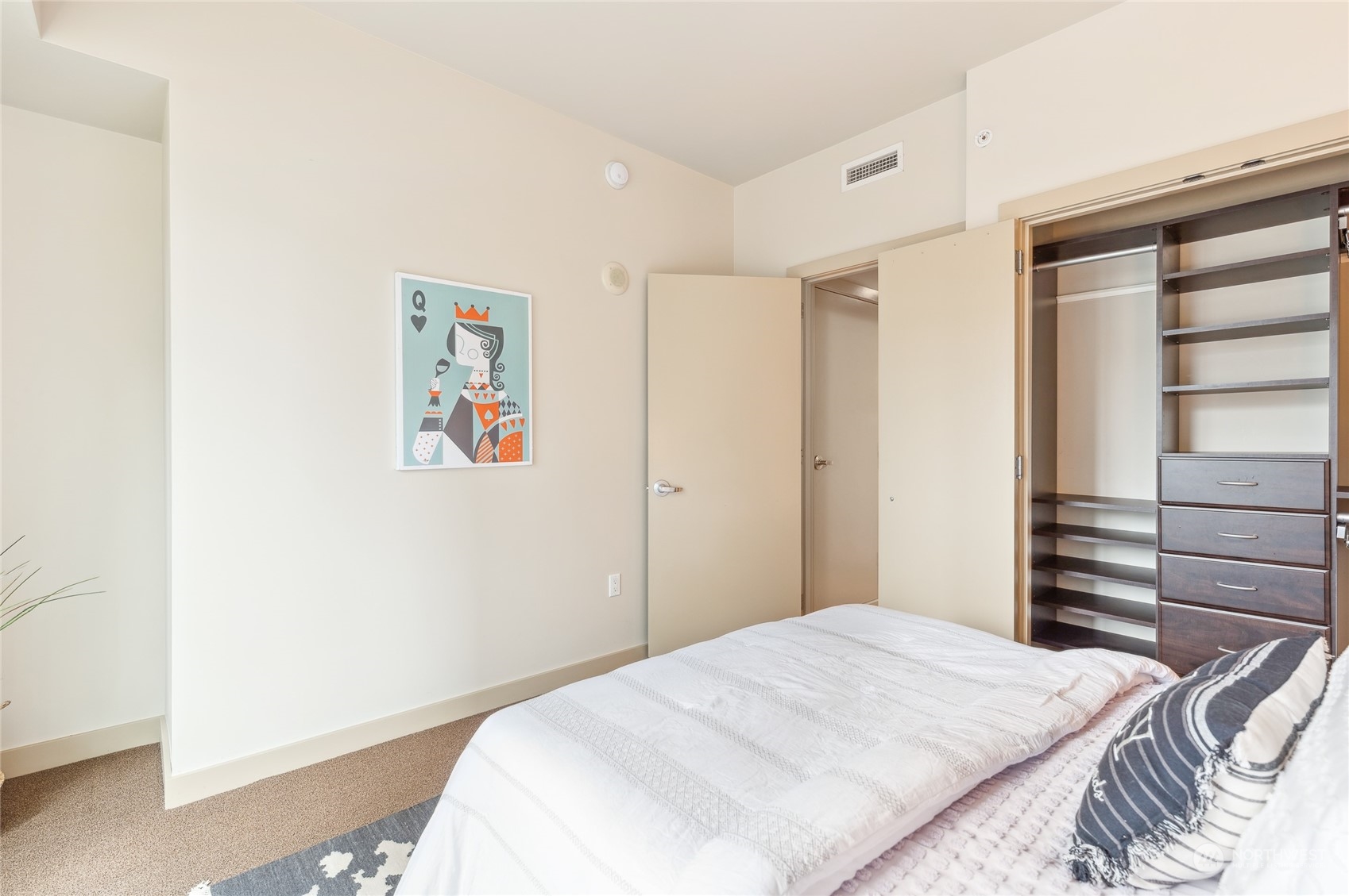 910 Lenora Street, Unit S907 Seattle, WA 98121 - Photo 28 of 38 a bedroom with a bed and a window