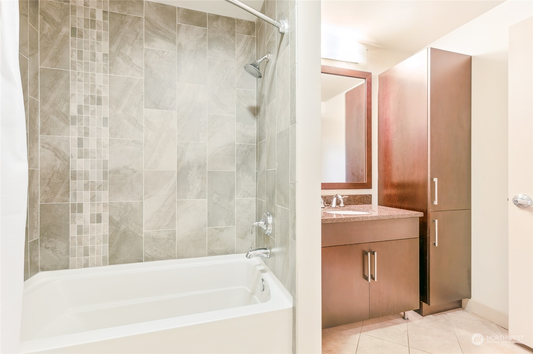 910 Lenora Street, Unit S907 Seattle, WA 98121 - Photo 30 of 38 a bathroom with a bathtub and shower