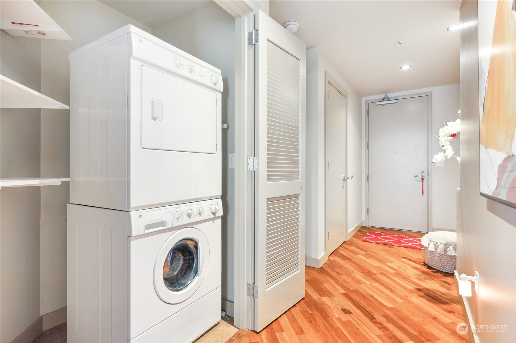 910 Lenora Street, Unit S907 Seattle, WA 98121 - Photo 31 of 38 a bedroom with a bed and a view of bathroom