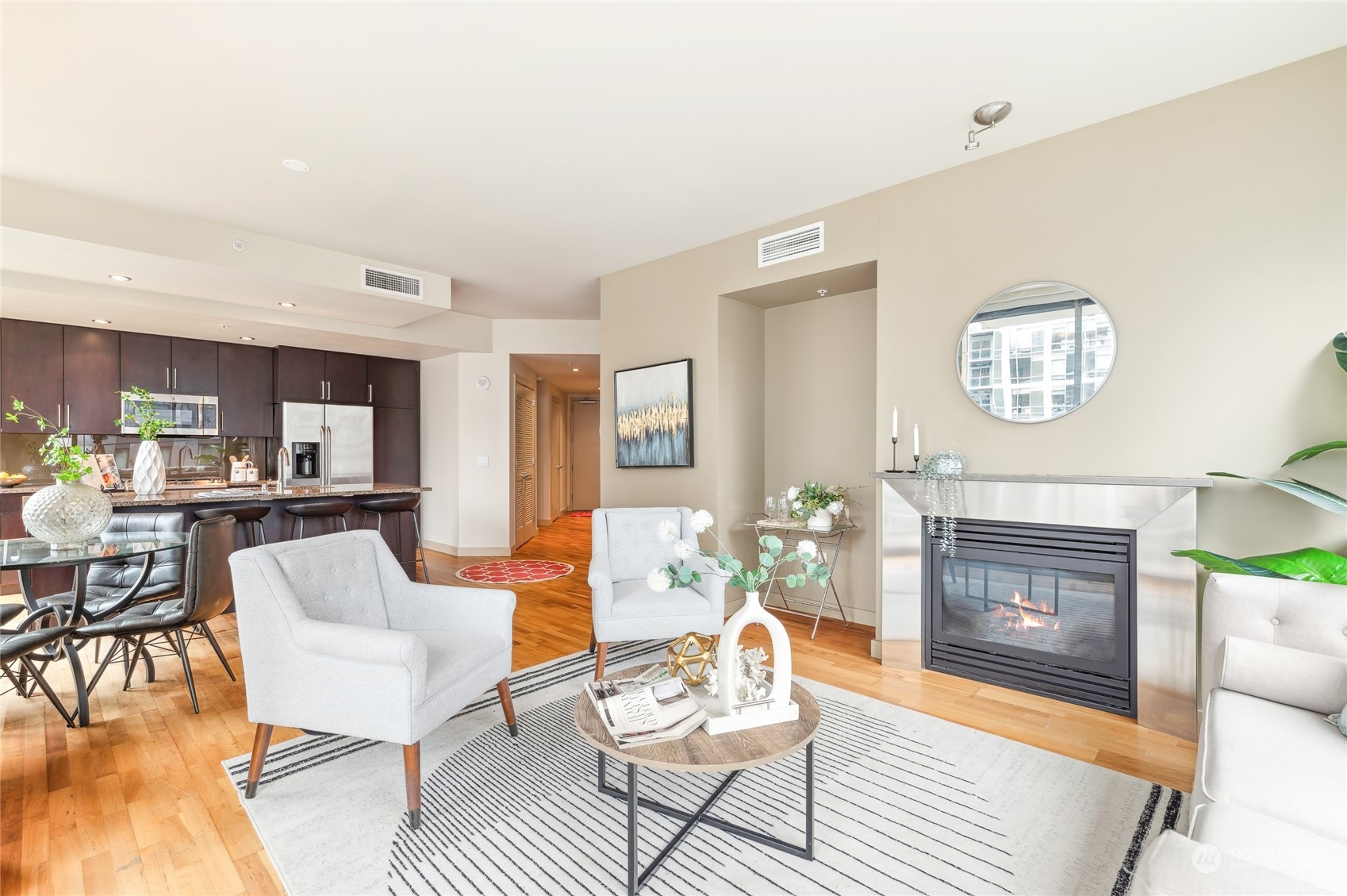 910 Lenora Street, Unit S907 Seattle, WA 98121 - Photo 7 of 38 a living room with furniture and a fireplace