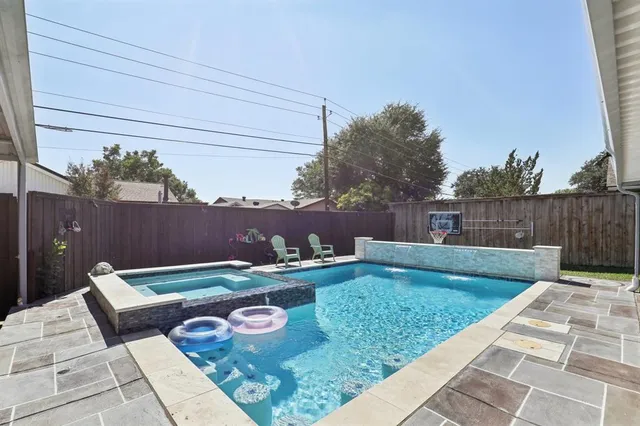 a view of a backyard with sitting area