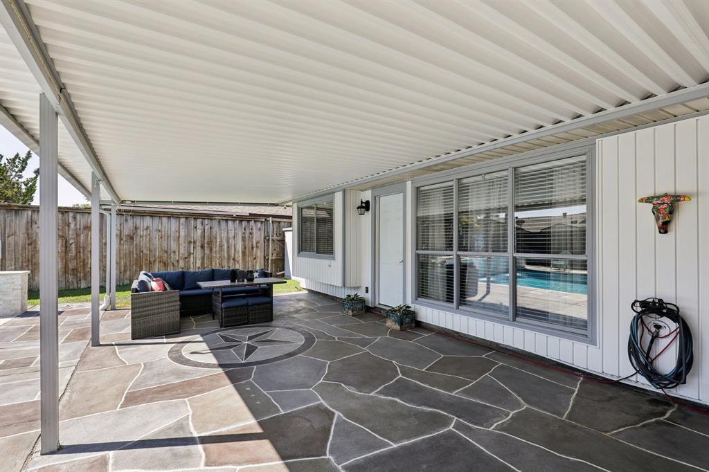 102 East Ridgegate Drive Garland, TX 75040 - Photo 22 of 31 a living room with a barbeque and stove