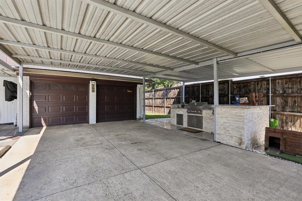 102 East Ridgegate Drive Garland, TX 75040 - Photo 23 of 31 a view of a porch and a garage
