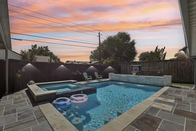 a view of a backyard with sitting area