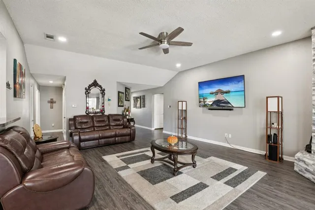 a living room with furniture and a rug