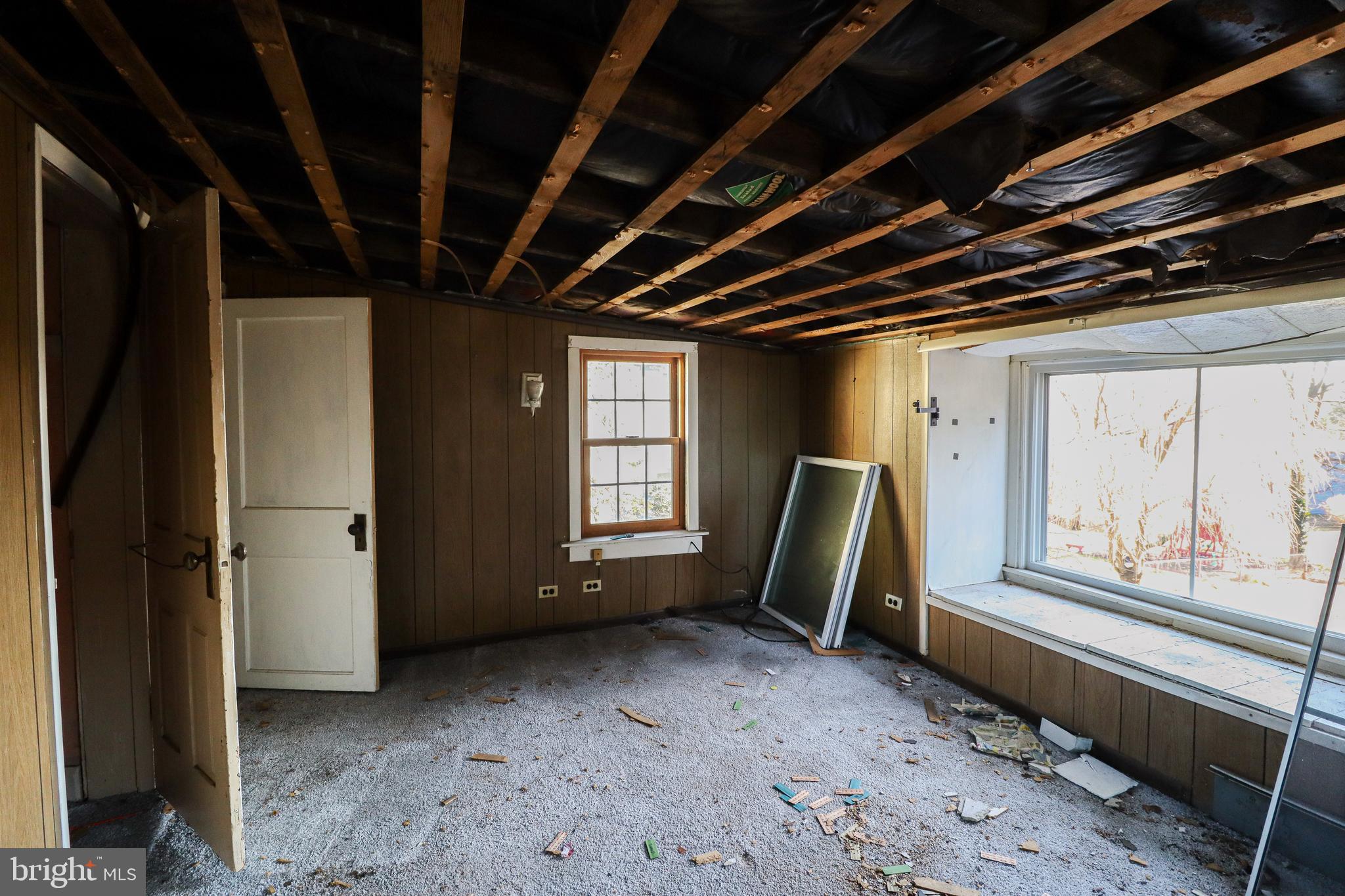 6481 Chambers Hill Road Harrisburg, PA 17111 - Photo 18 of 26 a view of an empty room with wooden floor and a window