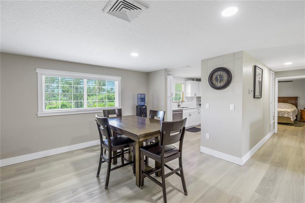 592 Ken Hubbard Road Terra Ceia, FL 34250 - Photo 11 of 34 a view of a dining room with furniture and window