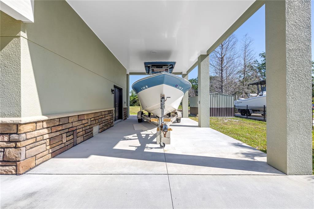 592 Ken Hubbard Road Terra Ceia, FL 34250 - Photo 31 of 34 a living room with a fireplace furniture and a table