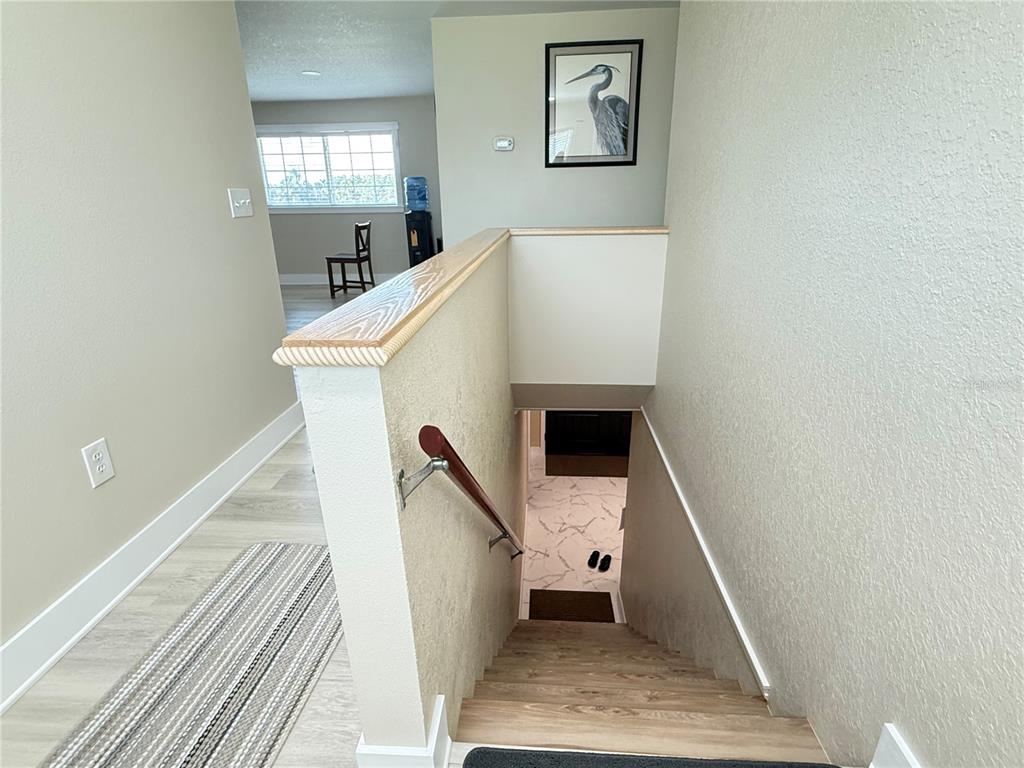 592 Ken Hubbard Road Terra Ceia, FL 34250 - Photo 8 of 34 a workspace with wooden floor and windows