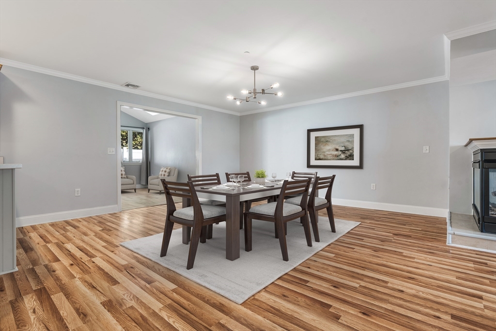 216 Rangeway Road, Unit 192 Billerica, MA 01862 - Photo 5 of 18 a view of a dining room with furniture and wooden floor