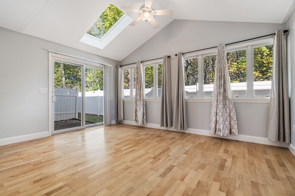 216 Rangeway Road, Unit 192 Billerica, MA 01862 - Photo 8 of 18 a view of an empty room with wooden floor and a window