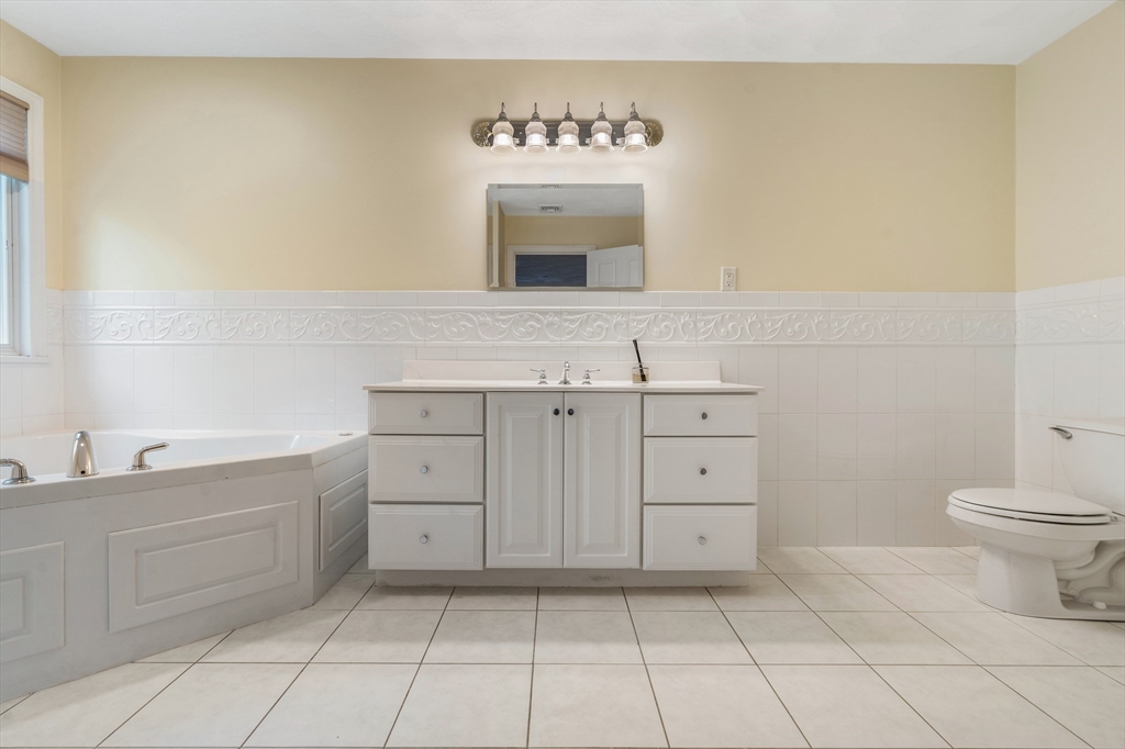 216 Rangeway Road, Unit 192 Billerica, MA 01862 - Photo 10 of 18 a bathroom with a sink a toilet and mirror