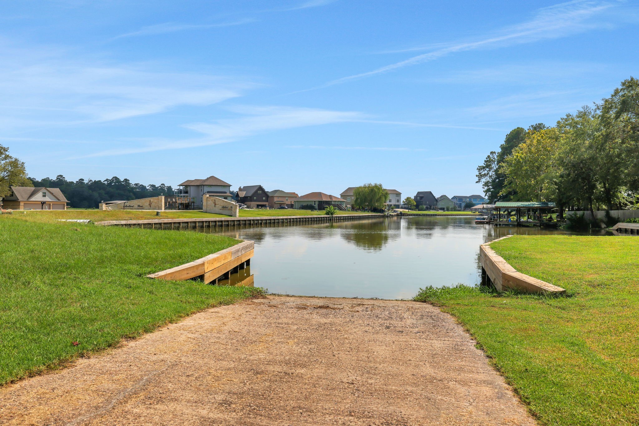 11 Peninsula Point Huntsville, TX 77340 - Photo 14 of 18 a view of a lake with houses in the back