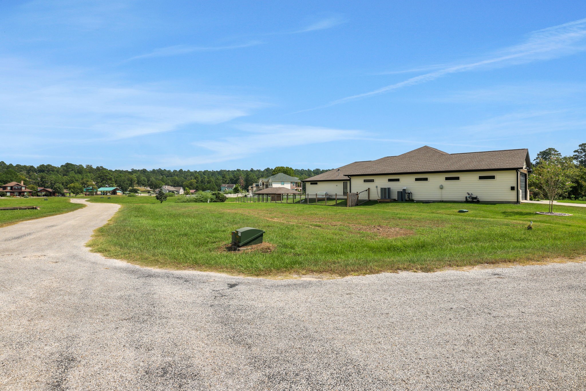 11 Peninsula Point Huntsville, TX 77340 - Photo 8 of 18 a view of a lake with houses in the back