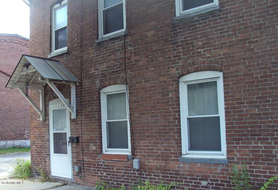 164 Columbia Street Adams, MA 01220 - Photo 1 of 9 a brick house with a large windows