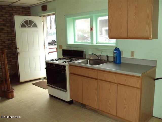 164 Columbia Street Adams, MA 01220 - Photo 3 of 9 a kitchen with stainless steel appliances a stove a sink and a microwave