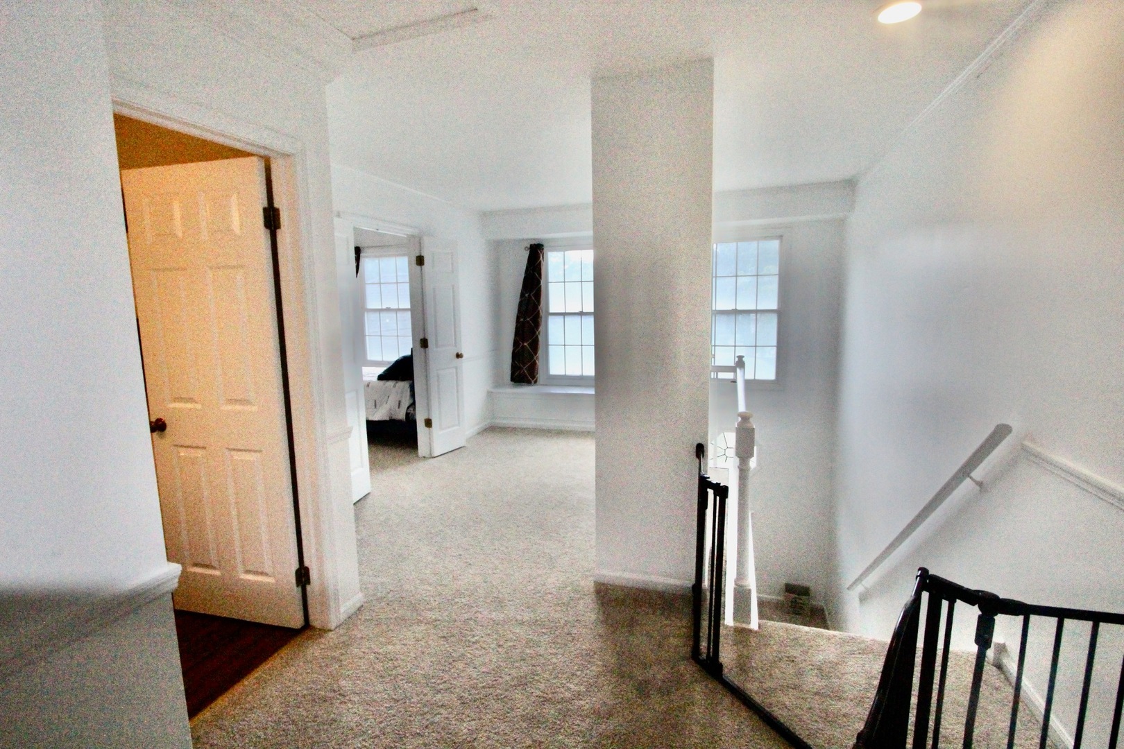 835 Suffield Square Lincolnshire, IL 60069 - Photo 20 of 44 a view of hallway with livingroom and stairs