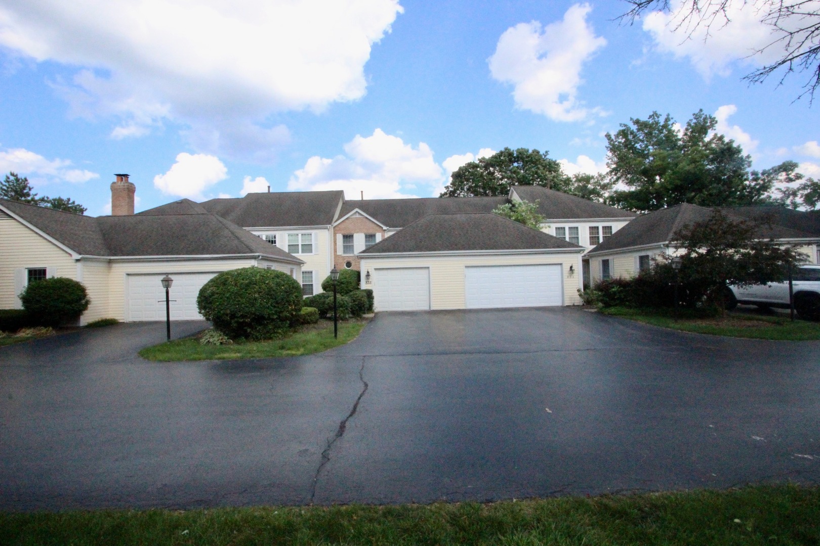 835 Suffield Square Lincolnshire, IL 60069 - Photo 2 of 44 a front view of a house with a yard and garage