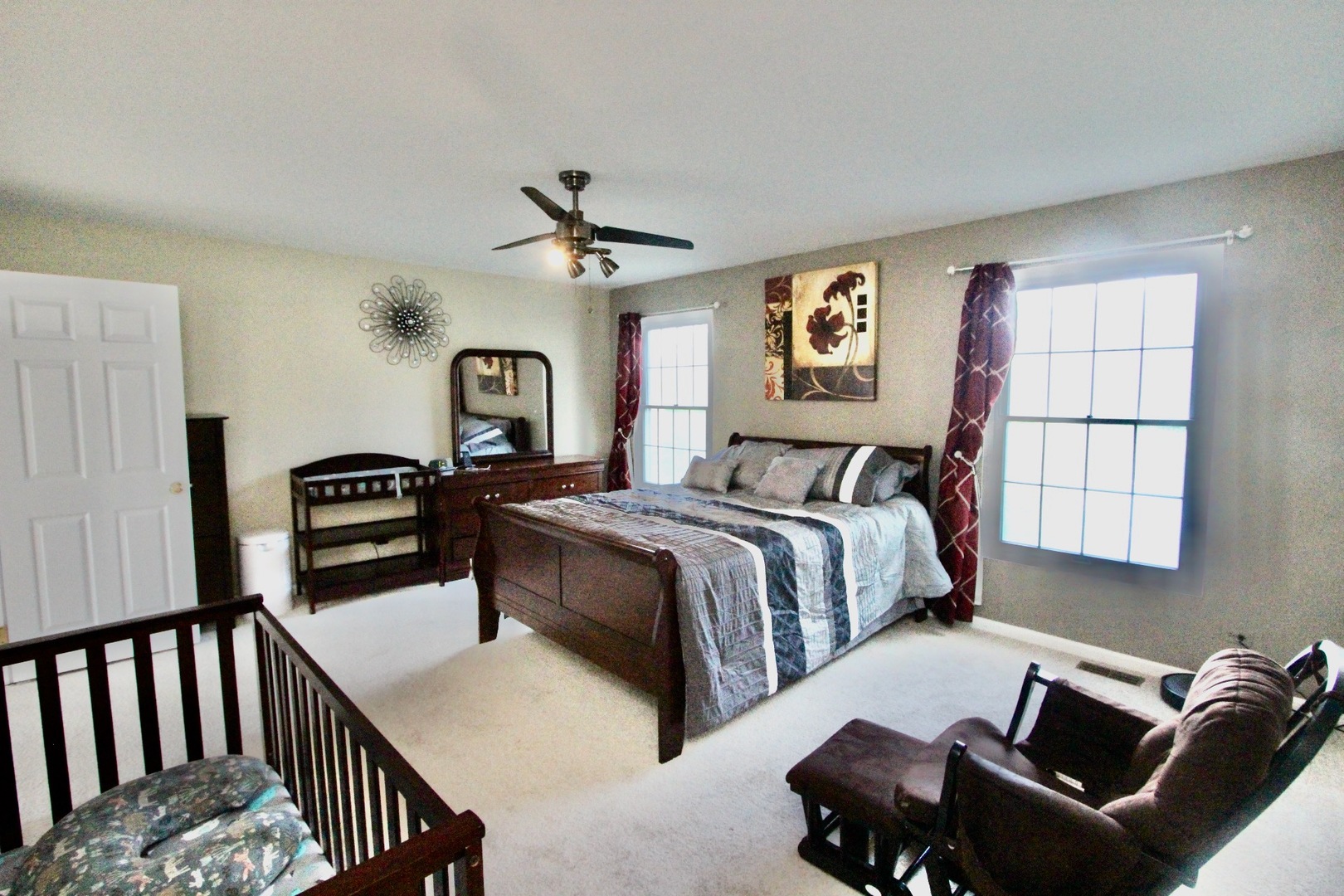 835 Suffield Square Lincolnshire, IL 60069 - Photo 22 of 44 a bedroom with a bed and a chandelier