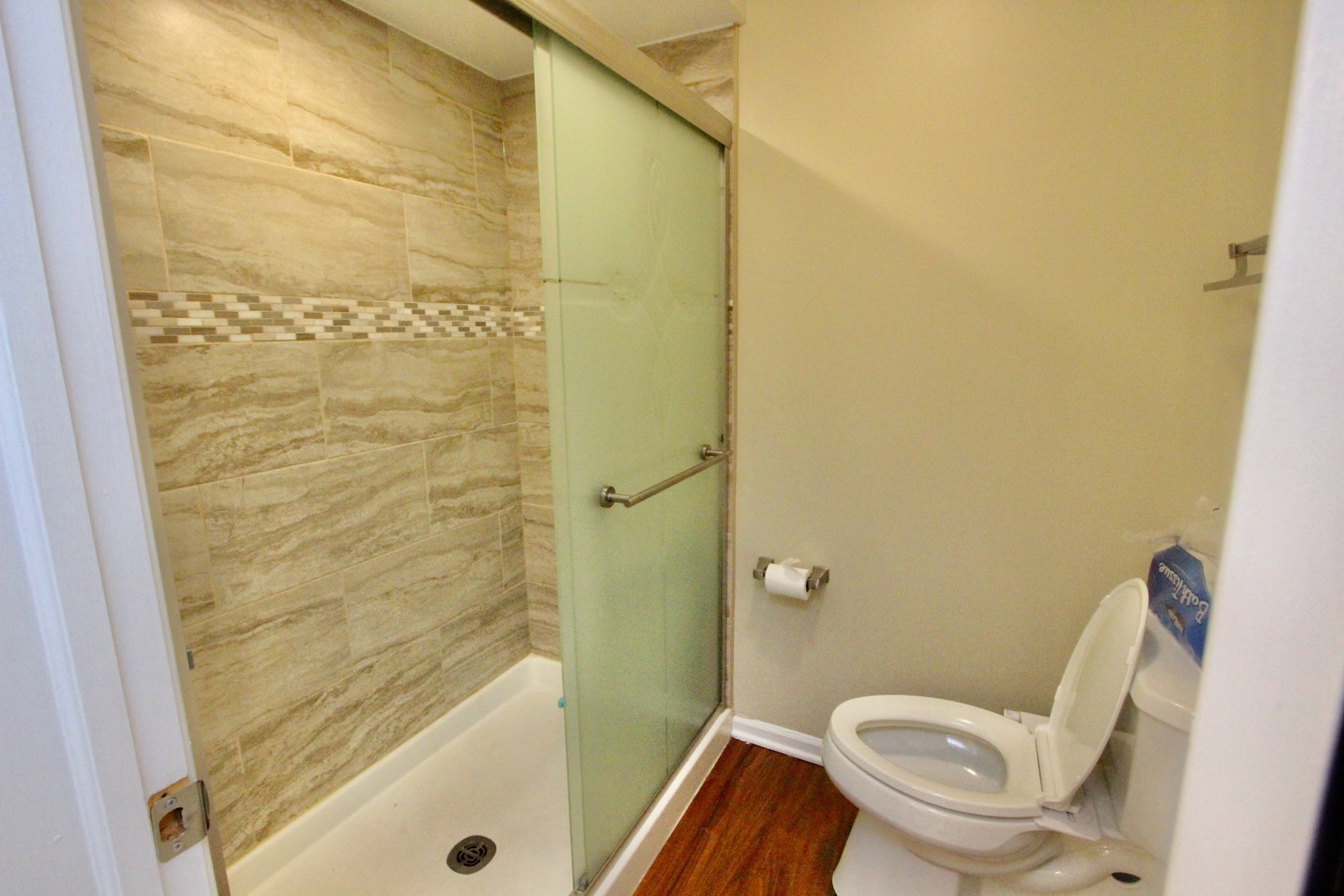 835 Suffield Square Lincolnshire, IL 60069 - Photo 25 of 44 a white toilet sitting next to a bath tub and shower