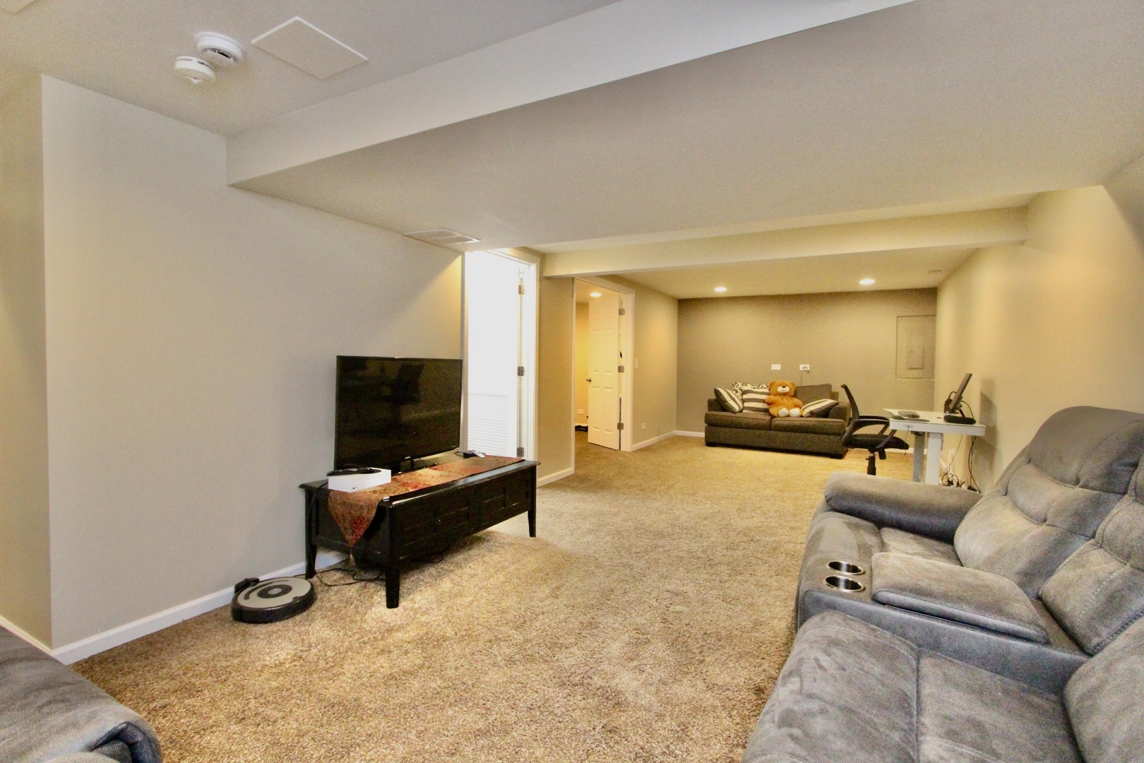 835 Suffield Square Lincolnshire, IL 60069 - Photo 34 of 44 a living room with furniture and a flat screen tv