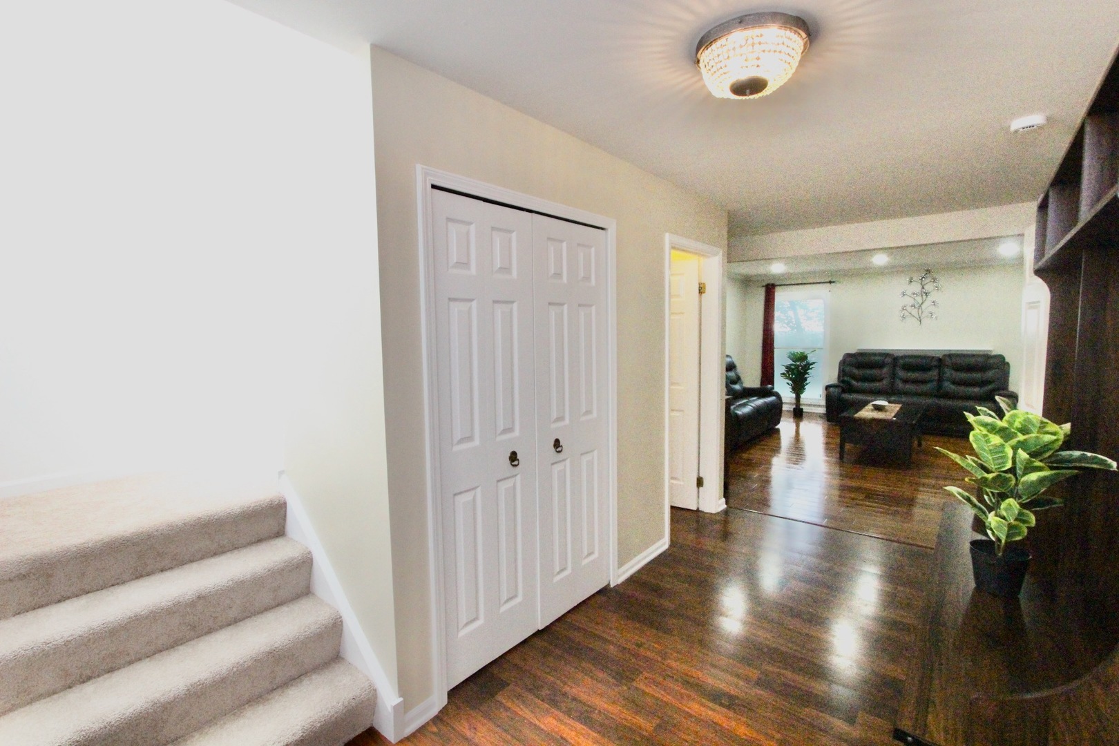 835 Suffield Square Lincolnshire, IL 60069 - Photo 4 of 44 a view of an entryway with wooden floor