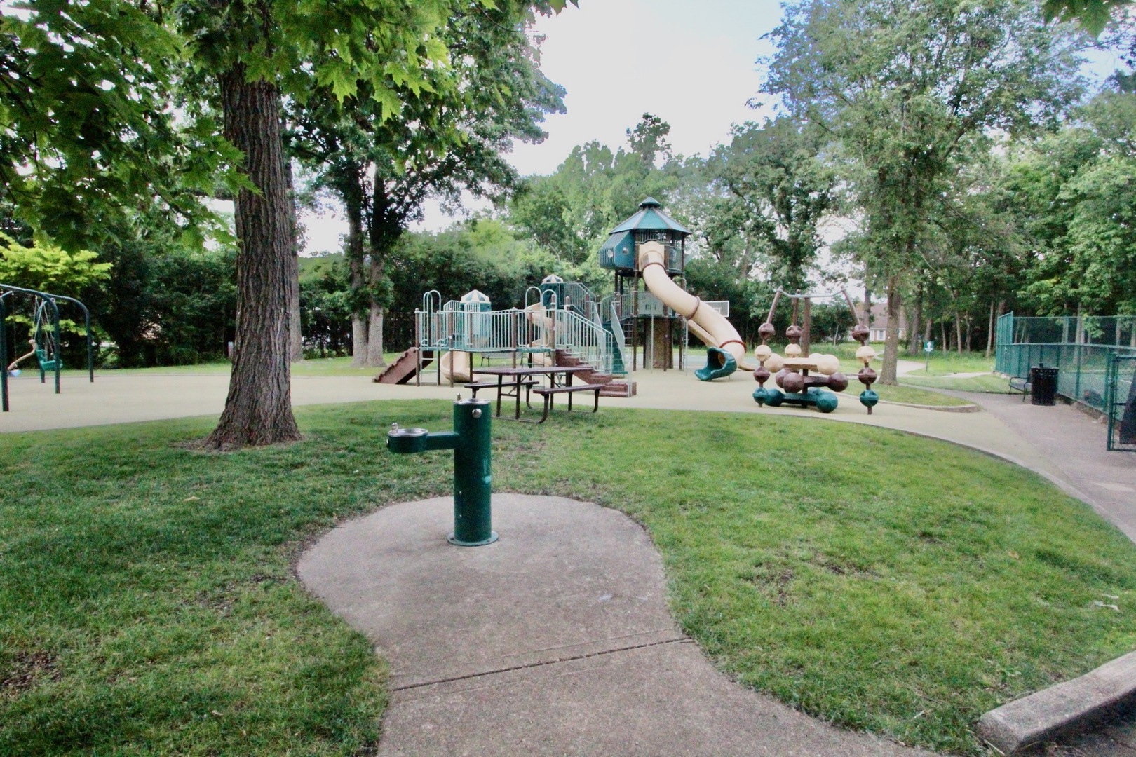 835 Suffield Square Lincolnshire, IL 60069 - Photo 41 of 44 a park view with a bench and trees