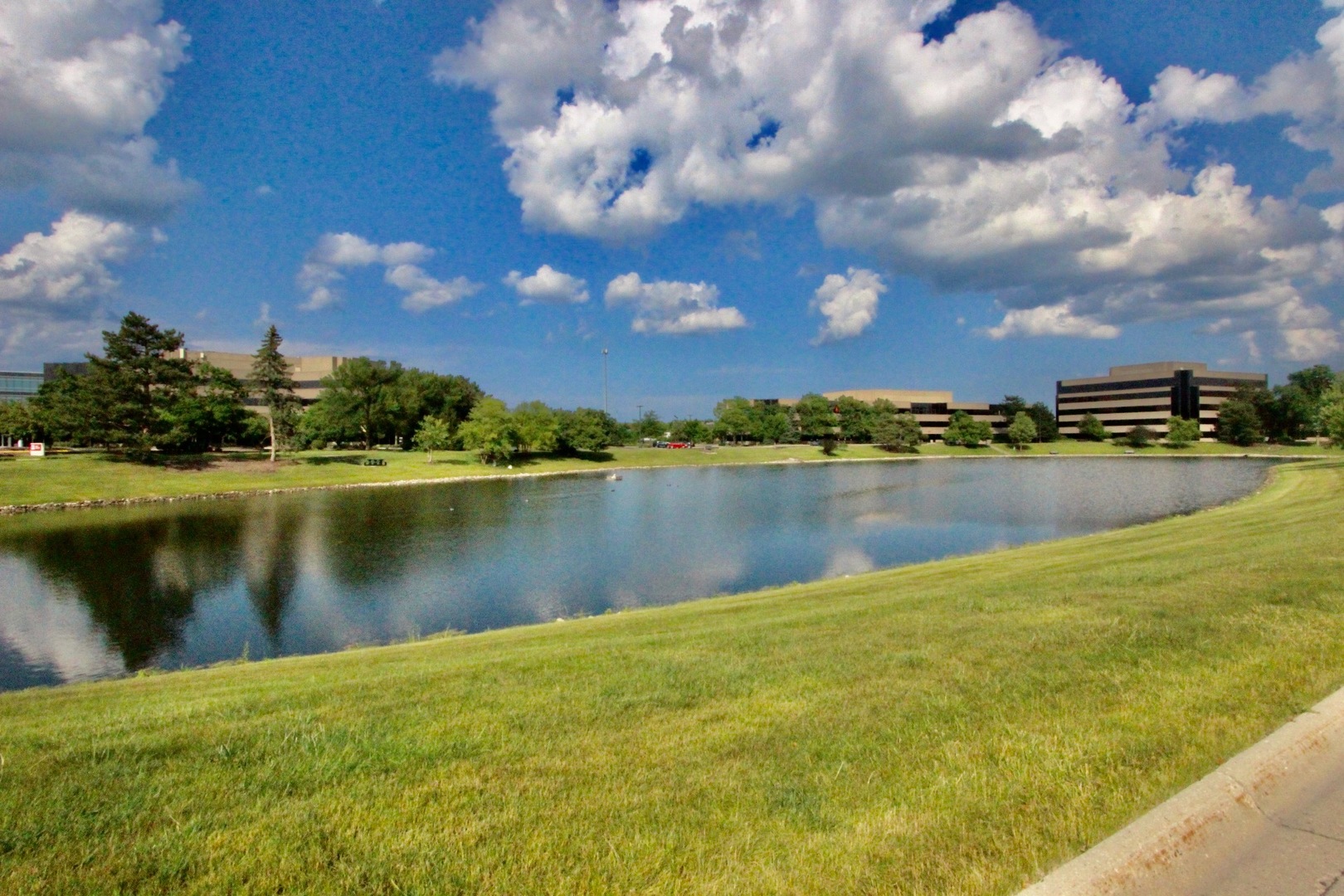 835 Suffield Square Lincolnshire, IL 60069 - Photo 43 of 44 a view of a lake in front of house with yard and outdoor seating