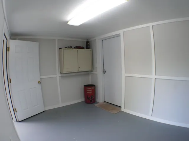 a view of a patio with table and chairs with wooden floor