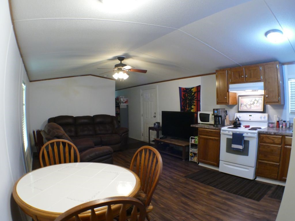 1615 East Wallisville Road Highlands, TX 77562 - Photo 25 of 32 a living room with furniture a dining table and a piano table