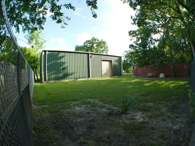 a view of a backyard with a garden