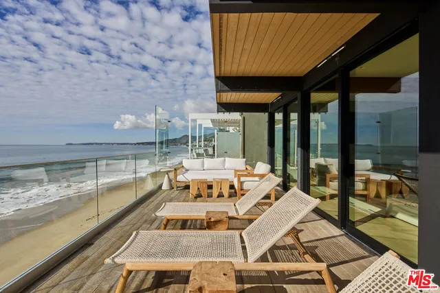 a view of swimming pool with seating area