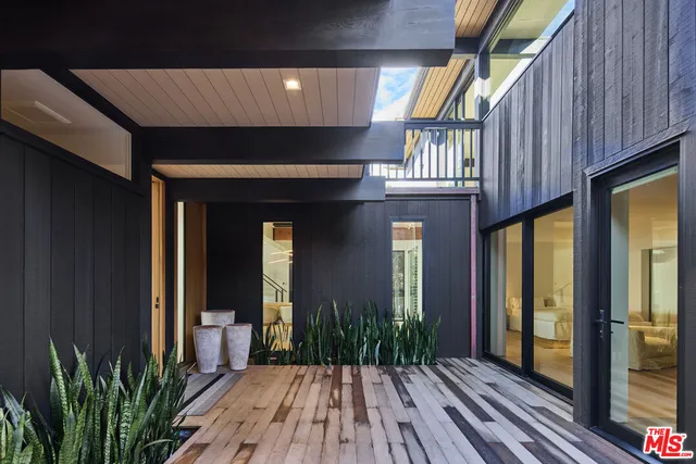 a view of front door of house with wooden floor