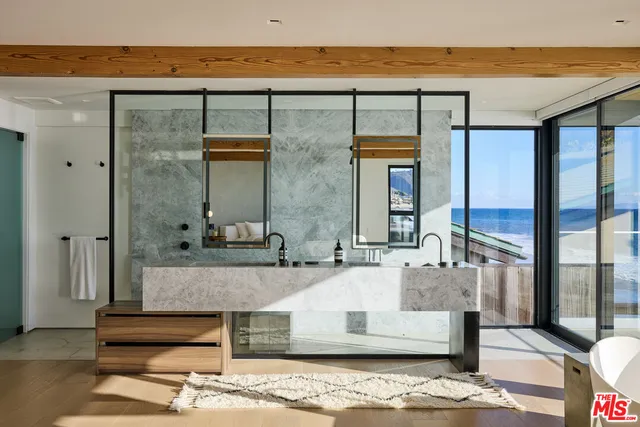 a living room with a bed and a fireplace