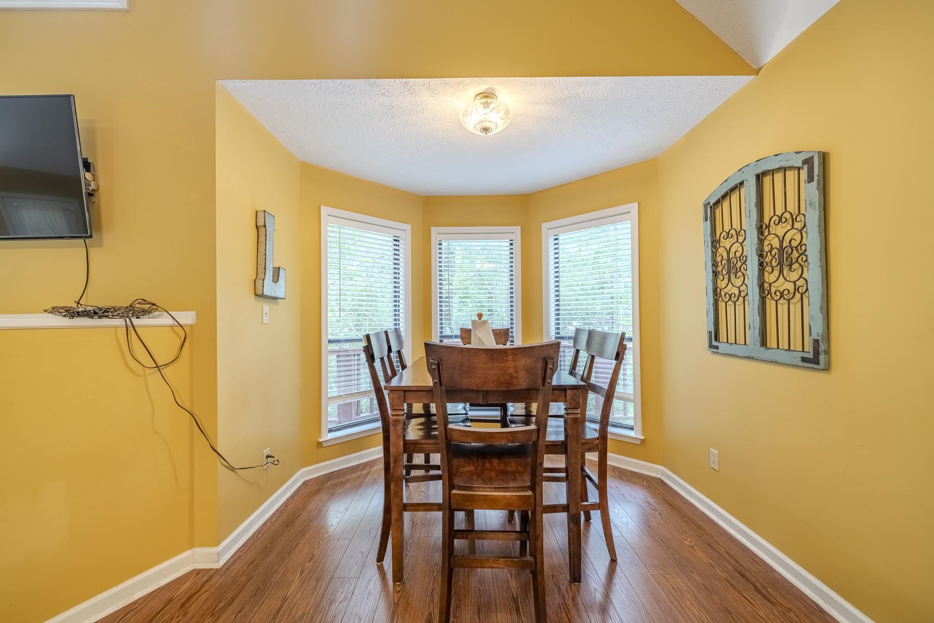 405 Murray Lane Counce, TN 38326 - Photo 13 of 36 a view of a dining room with furniture and wooden floor