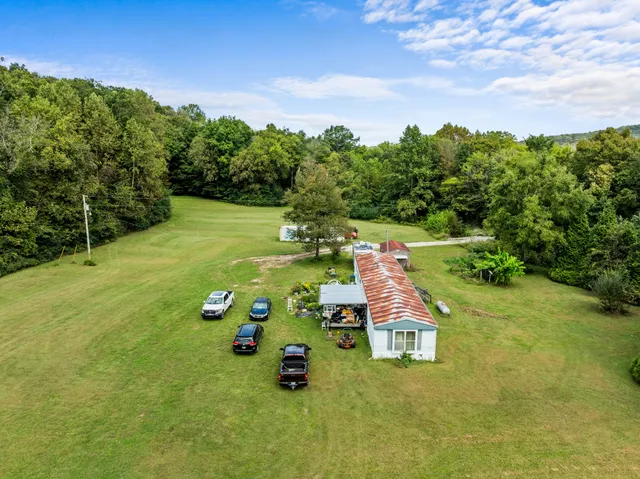 a view of a yard with an outdoor seating