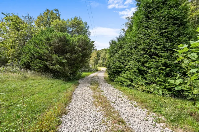 a picture of a room with a white wall and a large window